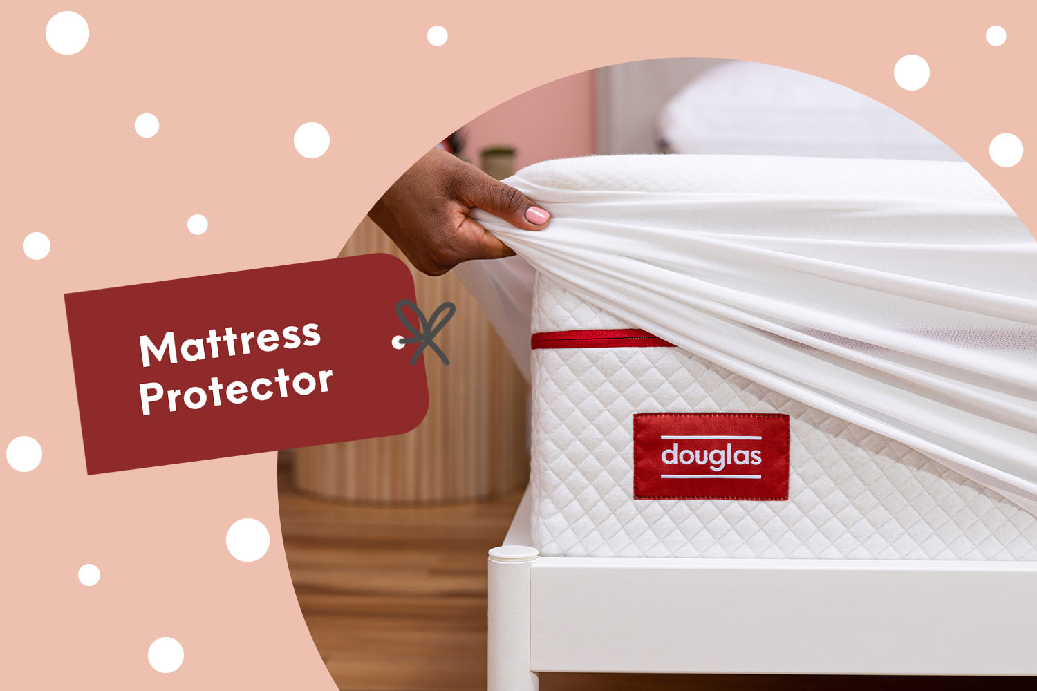 A person fitting a Mattress Protector on a Douglas mattress